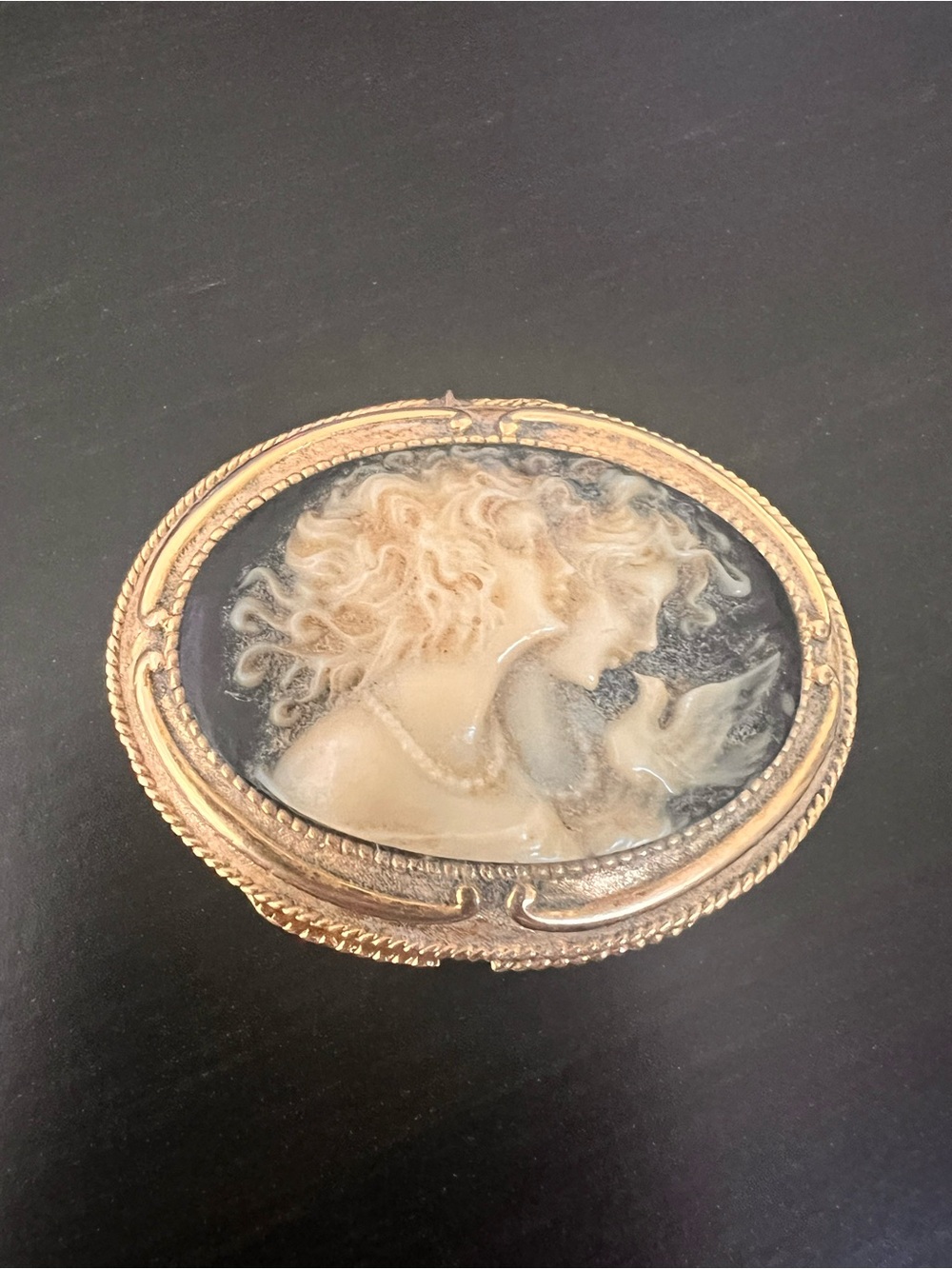 Estee Lauder Gold-Tone Cameo solid perfume holder.